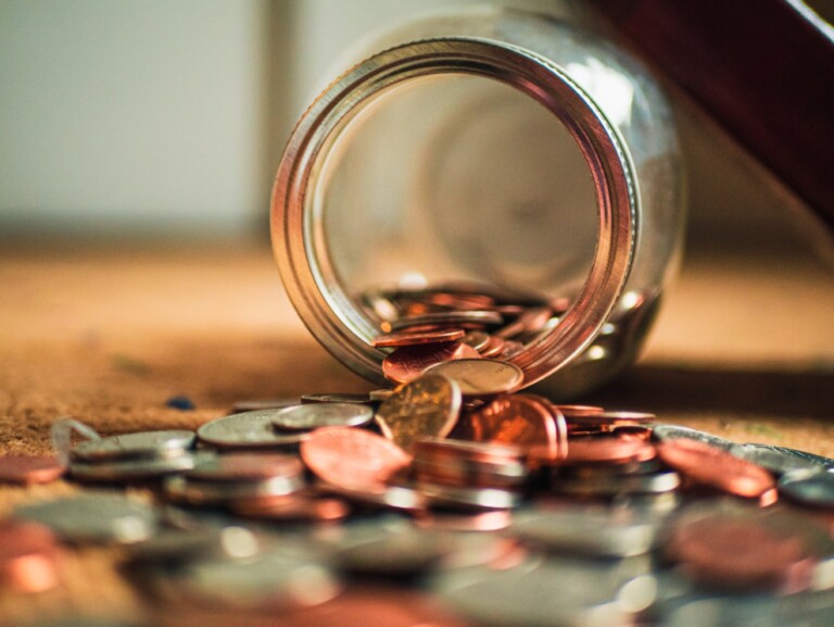 coins and money showing Emergency Funds Part 2: Optimal Solutions for Your Emergency Fund